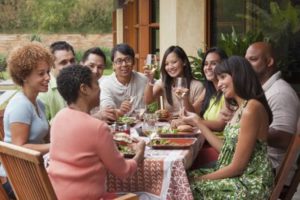 friends-enjoying-meal-together-outdoor